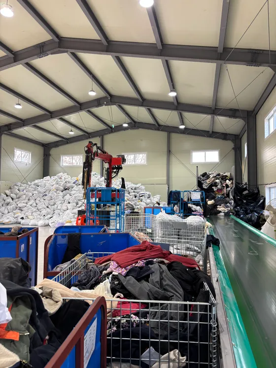 Workers sorting used clothing